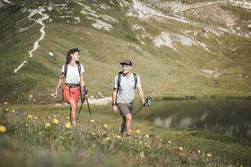 A man and a woman are hiking