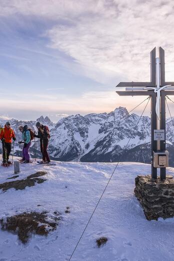 Three people on the summit of Hornischeck