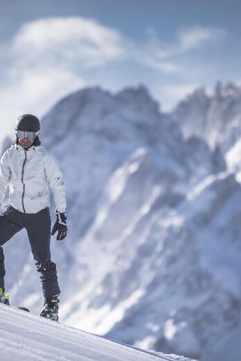 A man and a child are skiing